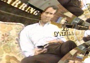 Al Bundy (Ed O'Neill, from Married with Children) on the sofa, hand in place