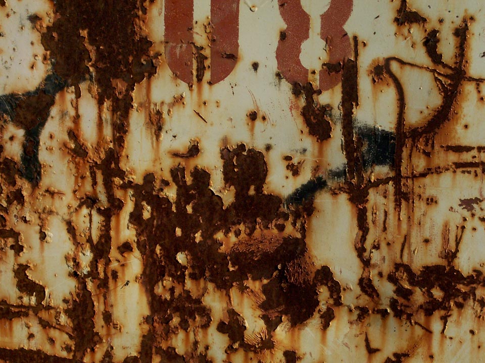 rust and numbers on a construction waste container; photo